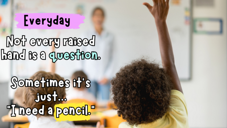 Elementary student raising a hand to ask for a pencil during class.